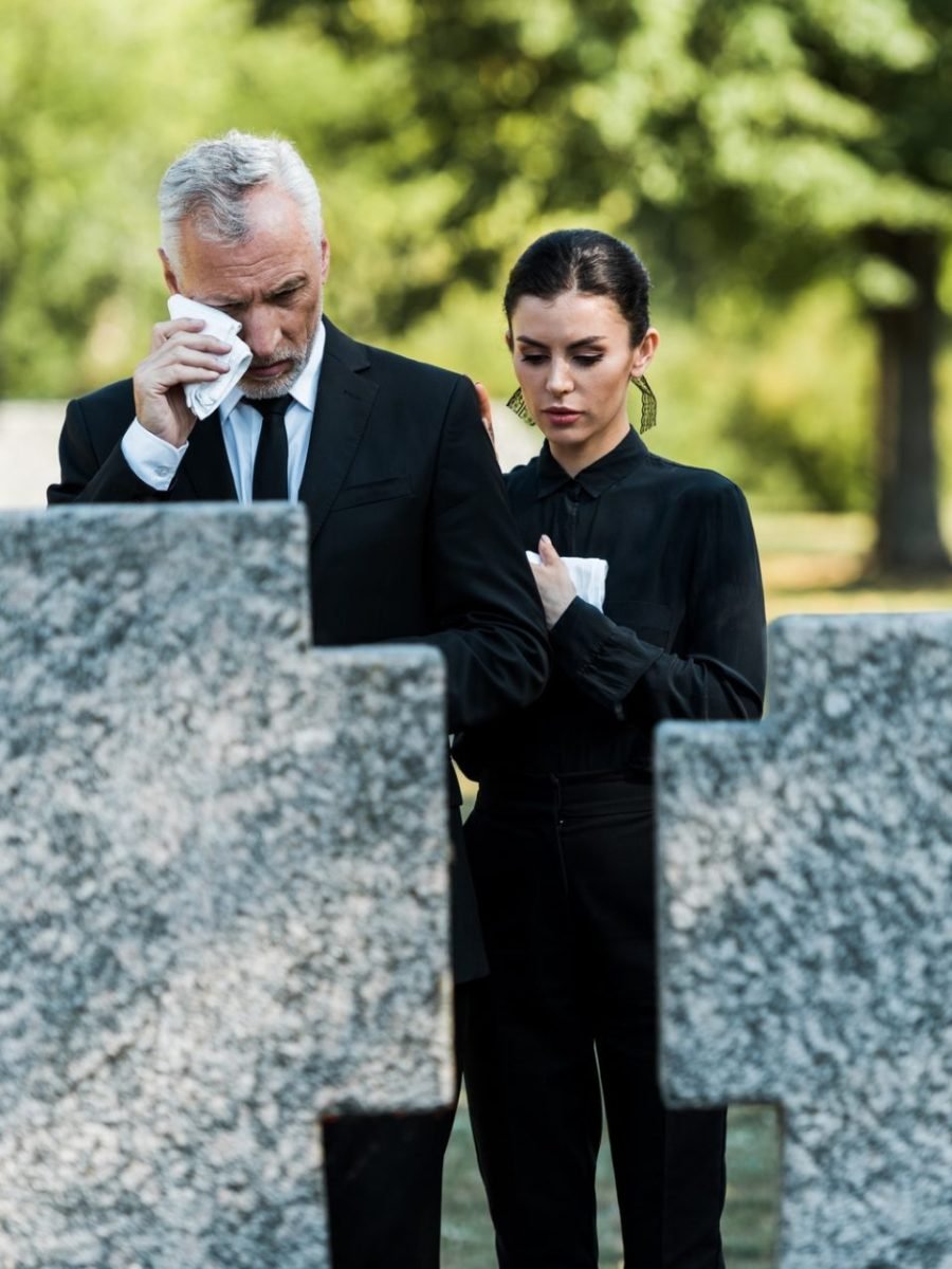 selective-focus-of-upset-man-crying-near-woman-on-funeral-e1636904714900.jpg